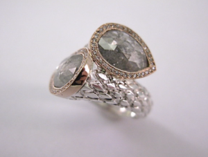 large silver ring with two large gemstones