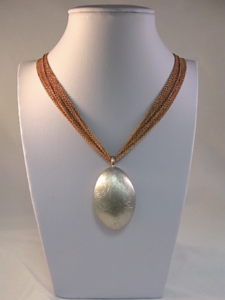 bold brown necklace with large pendant